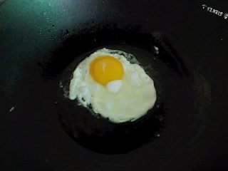 Heat a little oil in a pan, crack in the egg, and fry it sunny-side up.