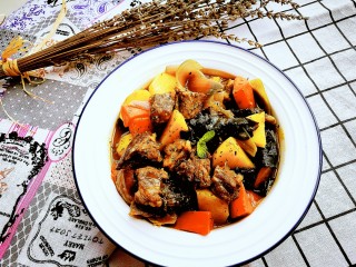 Add soy sauce and red wine. Cook over high heat until the sauce reduces and coats the ingredients.