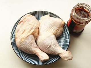 Poach the chicken with ginger and scallion until cooked through.
