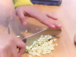 Add garlic, ginger, and pickled chili, then stir-fry until fragrant.